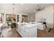 Open-concept kitchen and living room with fireplace and sliding doors to the backyard at 6428 E Nisbet Rd, Scottsdale, AZ 85254