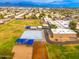Aerial view of a school with sports fields, basketball courts, and modern school buildings in a suburban setting at 6428 E Nisbet Rd, Scottsdale, AZ 85254