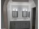 Bathroom with dual sink vanity and modern lighting at 702 W Sequoia Dr, Phoenix, AZ 85027
