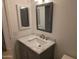 Updated bathroom vanity with marble countertop and new fixtures at 702 W Sequoia Dr, Phoenix, AZ 85027