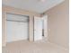 Bedroom with a walk-in closet and a view to the hallway at 702 W Sequoia Dr, Phoenix, AZ 85027