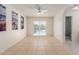 Light-filled bedroom with tile flooring and access to a backyard swimming pool at 702 W Sequoia Dr, Phoenix, AZ 85027