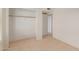 Bedroom closet and ensuite entry featuring neutral paint, and neutral flooring at 702 W Sequoia Dr, Phoenix, AZ 85027