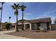 Charming single-Gathering home featuring a two-car garage, desert landscaping, and palm trees at 702 W Sequoia Dr, Phoenix, AZ 85027