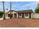 Inviting single-story home with desert landscaping, offering a serene and low-maintenance outdoor space at 702 W Sequoia Dr, Phoenix, AZ 85027