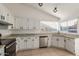 Kitchen with white cabinetry, stainless steel appliances and tiled floor at 702 W Sequoia Dr, Phoenix, AZ 85027