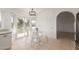 Eat-in kitchen featuring granite countertops, white cabinetry, and backyard views at 702 W Sequoia Dr, Phoenix, AZ 85027