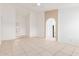 Open-concept living room with tile flooring, neutral walls, and a seamless transition to adjacent spaces at 702 W Sequoia Dr, Phoenix, AZ 85027