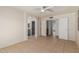 Primary bedroom with a ceiling fan, tile floors and access to the bathroom and closet at 702 W Sequoia Dr, Phoenix, AZ 85027