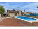 Backyard pool with an adjacent patio provides an outdoor living space for relaxation and recreation at 702 W Sequoia Dr, Phoenix, AZ 85027