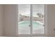 View from the sliding glass door to a private backyard pool at 702 W Sequoia Dr, Phoenix, AZ 85027