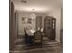 Elegant dining room features stylish table and chairs, decorative hutch, and modern light fixture at 7616 W Jones Ave, Phoenix, AZ 85043