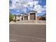 Charming single-story home featuring a large garage, well-maintained landscaping, and a paver driveway at 7616 W Jones Ave, Phoenix, AZ 85043