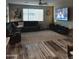 Comfortable living room features a large sectional sofa, television, and neutral decor at 7616 W Jones Ave, Phoenix, AZ 85043