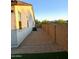 Low maintenance side yard with gravel and block wall, with an air conditioner visible at 7616 W Jones Ave, Phoenix, AZ 85043