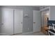 Bedroom featuring closet with sliding doors and a view into a room with a desk and computer at 8524 S 49Th Ln, Laveen, AZ 85339