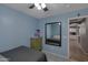 Bedroom featuring a mirror that reflects another bed and has an entryway to the kitchen at 8524 S 49Th Ln, Laveen, AZ 85339