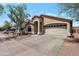 Charming home with a desert landscape, two-car garage, and covered front porch at 8524 S 49Th Ln, Laveen, AZ 85339