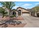 Charming single-story home with a well-manicured front yard and a two-car garage at 8524 S 49Th Ln, Laveen, AZ 85339