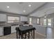 View of the kitchen area, showcasing white cabinets and plenty of natural light at 8524 S 49Th Ln, Laveen, AZ 85339