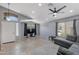 Bright living room with ceiling fan, tile floors and view to the front entrance at 8524 S 49Th Ln, Laveen, AZ 85339