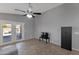 Spacious living room features a ceiling fan, access to the backyard, and plenty of space at 8524 S 49Th Ln, Laveen, AZ 85339