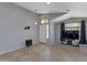 Inviting living area with large window, ceiling fan, and tile flooring at 8524 S 49Th Ln, Laveen, AZ 85339