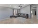 Comfortable living room featuring a large sectional sofa and neutral decor at 8524 S 49Th Ln, Laveen, AZ 85339