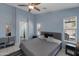 Cozy main bedroom offers natural light, neutral walls, and tile flooring at 8524 S 49Th Ln, Laveen, AZ 85339