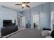 Inviting main bedroom boasts tile flooring, ample closet space, and an ensuite bathroom at 8524 S 49Th Ln, Laveen, AZ 85339