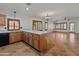 Open-concept kitchen and living area featuring a large island and abundant natural light at 9852 W Salter Dr, Peoria, AZ 85382