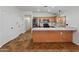 Open kitchen with island, stainless steel refrigerator, and plenty of cabinet space at 9852 W Salter Dr, Peoria, AZ 85382