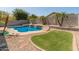 Inviting backyard pool and lush landscaping create a private oasis for relaxation and enjoyment at 9852 W Salter Dr, Peoria, AZ 85382