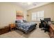 This bedroom is bright and spacious with carpet and accent artwork at 10934 E La Verna Way, Scottsdale, AZ 85262