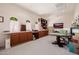 Large bonus room with ample storage, workspace, and natural light at 10934 E La Verna Way, Scottsdale, AZ 85262