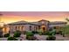 Beautiful home with desert landscaping, stone accents, and a tiled roof at 10934 E La Verna Way, Scottsdale, AZ 85262
