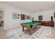Spacious game room featuring a pool table, complemented by neutral walls adorned with decorative artwork at 10934 E La Verna Way, Scottsdale, AZ 85262