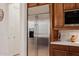 Stainless steel refrigerator with water dispenser, set within a kitchen featuring wooden cabinets and countertops at 10934 E La Verna Way, Scottsdale, AZ 85262