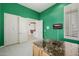 Home office with shutters, custom built ins, open doorway, and island desk at 10934 E La Verna Way, Scottsdale, AZ 85262