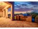 Covered patio with stainless steel built-in grill, prep area, and views of the backyard at 10934 E La Verna Way, Scottsdale, AZ 85262