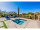 Inviting backyard with private pool, spa and fire pit surrounded by desert landscaping at 10934 E La Verna Way, Scottsdale, AZ 85262