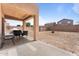 Spacious backyard with a covered patio and potential for landscaping at 10939 W Meadowbrook Ave, Phoenix, AZ 85037
