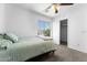 Bedroom features a window, neutral walls, and carpet at 10939 W Meadowbrook Ave, Phoenix, AZ 85037