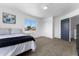 Cozy bedroom with carpet flooring, closet, and a serene atmosphere at 10939 W Meadowbrook Ave, Phoenix, AZ 85037