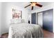 Cozy bedroom showcasing a comfortable bed, soft lighting, and closet, perfect for relaxation at 10939 W Meadowbrook Ave, Phoenix, AZ 85037