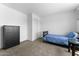 Bedroom features a neutral walls, carpet, and closet at 10939 W Meadowbrook Ave, Phoenix, AZ 85037