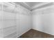 Walk-in closet with white wire shelving and neutral carpeting at 10939 W Meadowbrook Ave, Phoenix, AZ 85037