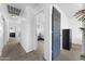 Hallway view features open bedroom door with view into room at 10939 W Meadowbrook Ave, Phoenix, AZ 85037