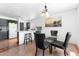 Cozy kitchen, bar seating, stylish countertops, and adjacent dining area that combines comfort and modern design at 10939 W Meadowbrook Ave, Phoenix, AZ 85037