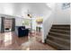 Comfortable living room featuring tile floors, a ceiling fan, and ample natural light at 10939 W Meadowbrook Ave, Phoenix, AZ 85037